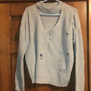 Buckle distressed sweater